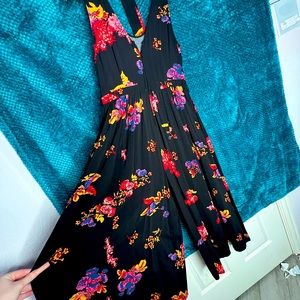 Beautiful floral romper with matching belt.